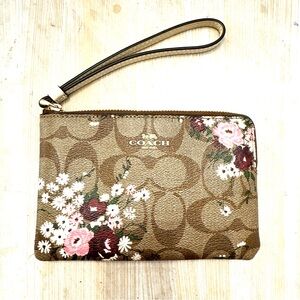 COACH Brown Signature Floral Canvas Wristlet with Pink Accents